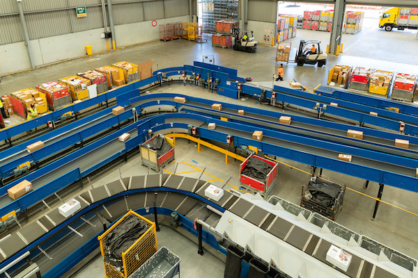 View of parcels being sorted in a factory