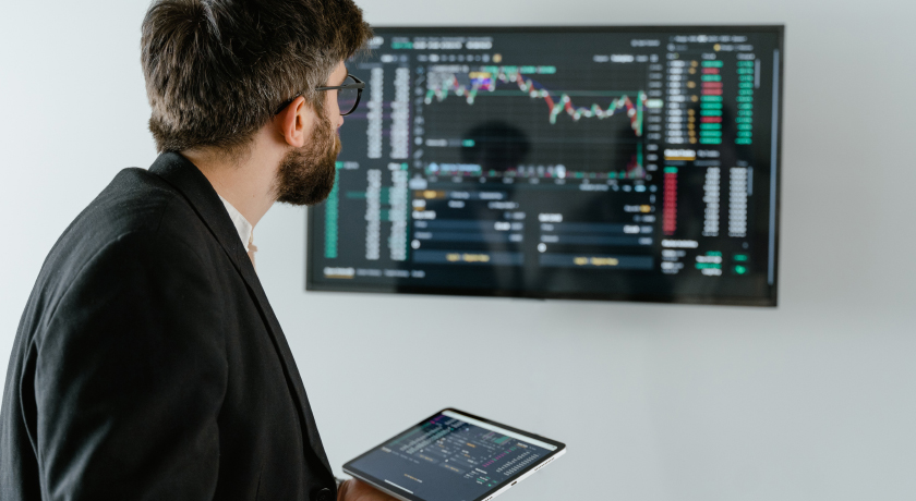 Analyst reviewing the data on a wall mounted screen