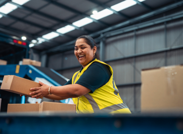 Women in the delivery center moving parcels