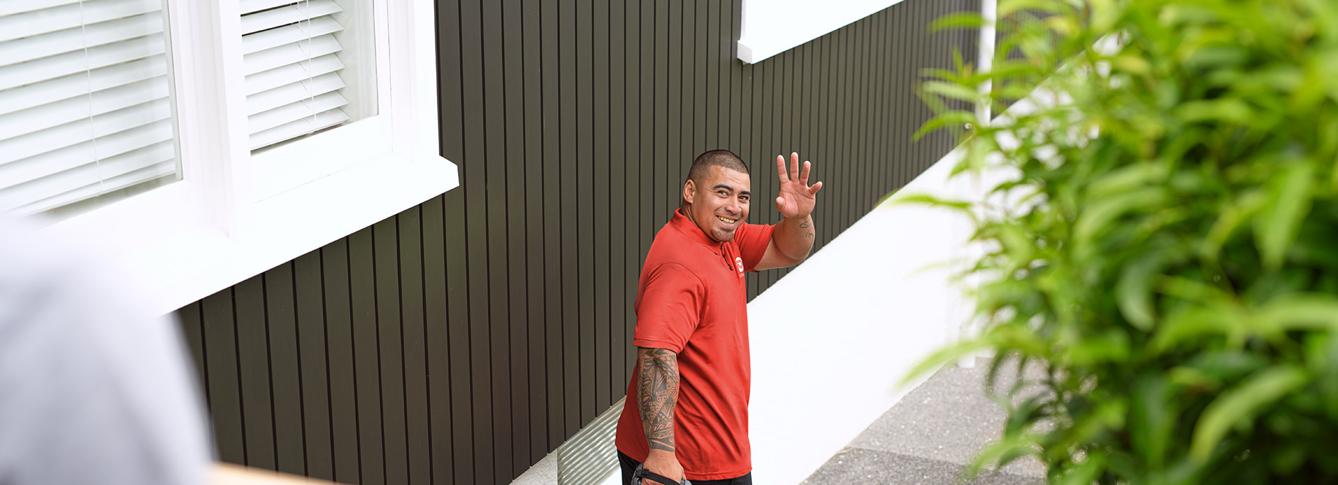 Delivery man waving
